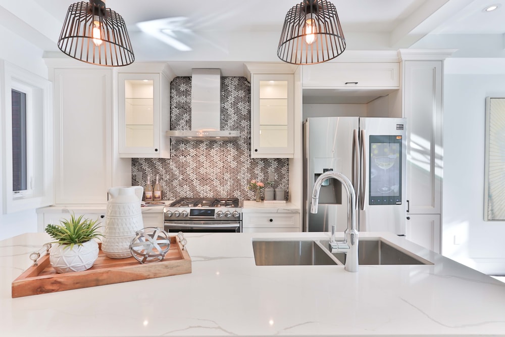 Kitchen with tile backsplash and pendant lighting